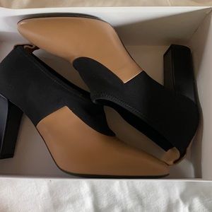 Black and tan boot shoes